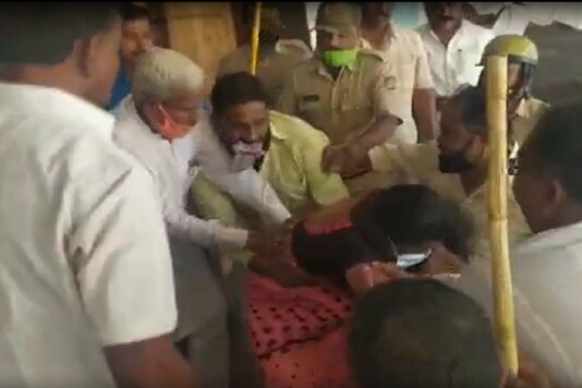 Screen grab of BJP MLA Siddu Savadi dragging party councillor Chandni Naik outside the Mahalingapura Town Municipal Council building.