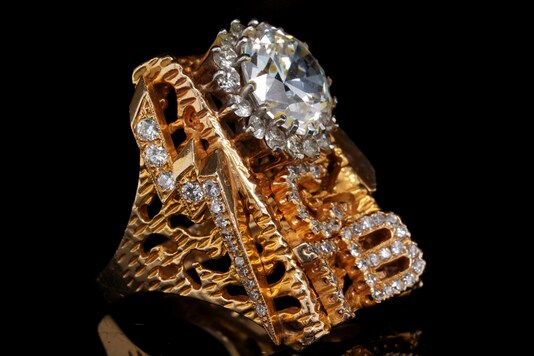 A gold and diamond TCB (Taking Care of Business) ring worn by the late Elvis Presley is seen in an undated handout photo ahead of an auction in Los Angeles. (Credit: REUTERS)
