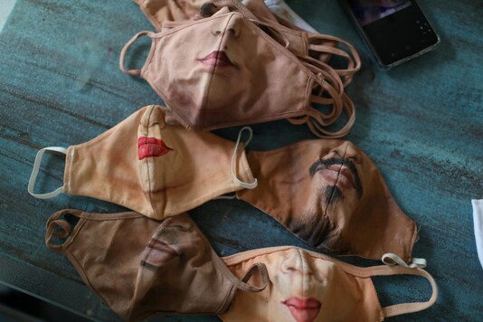 Customized protective masks made by plastic artist Jorge Silva Roriz are displayed. (Photo: REUTERS)