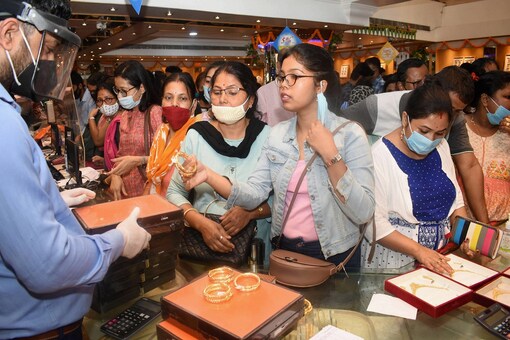 Women shop for jewellery during 'Dhanteras' festival on the eve of Diwali festival, in Guwahati, on Friday. (PTI)