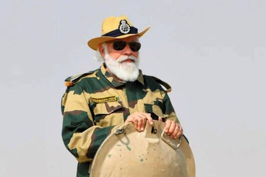 Prime Minister Narendra Modi rides a tank during his visit to strategic Longewala post in Jaisalmer, on November 14, 2020. (PTI Photo)