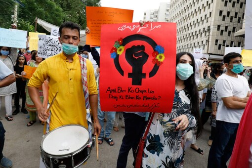 For Representation. People carry signs against a gang-rape that occurred along a highway and to condemn violence against women and girls, during a protest in Karachi, on September 12, 2020. (REUTERS/Akhtar Soomro)