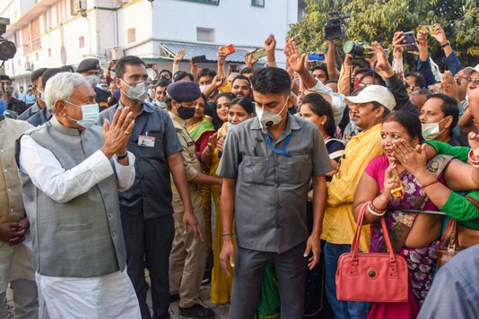 Janata Dal (United) president Nitish Kumar is greeted by supporters as he arrives at party office, in Patna, on November 12, 2020. (PTI Photo)