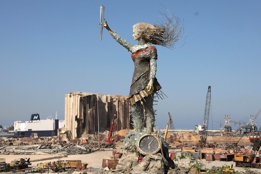 A view shows a statue by Lebanese artist, Hayat Nazer, which is made entirely out of broken glass and debris of the August 4 port explosion, near the port of Beirut, Lebanon. (REUTERS/Mohamed Azakir)