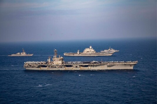 Indian Navy's Vikramaditya Carrier Battle Group exercising with US Navy's Nimitz Carrier Strike Group, Australian Navy ship HMAS Ballarat and JMSDF ship JS Onami during phase 2 of Malabar exercise. .