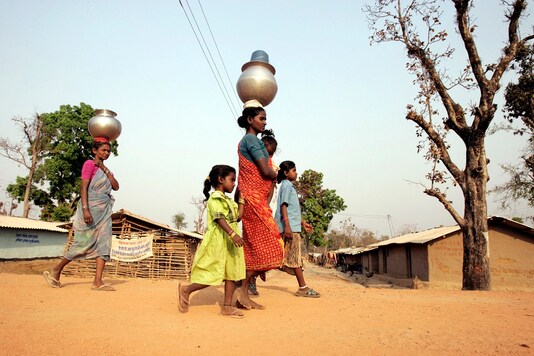 Tribal's return home after fetching water in a refugee camp in the Maoist prone forest area near Bhairamgarh village outside of Chhattisgarh's Raipur. (Image for representation)