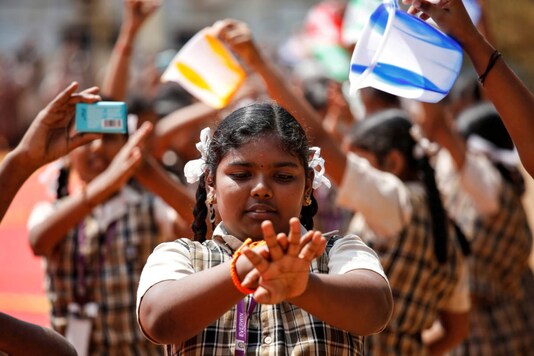 A student demonstrates how to wash hands during an awareness campaign about coronavirus disease, at a school in Chennai, on March 14, 2020. (REUTERS)