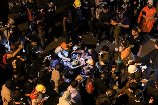 Protesters make hotpot in front of police headquarters during a rally in Bangkok, Thailand. (REUTERS/Soe Zeya Tun)