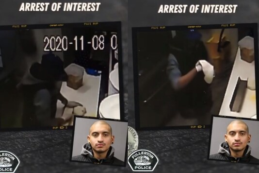Video grab of the burglar making himself a pizza. 