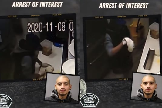 Video grab of the burglar making himself a pizza. Video grab of the burglar making himself a pizza.