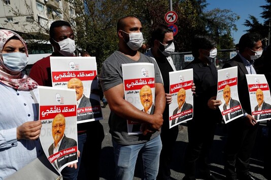 For representation: People hold pictures of Saudi journalist Jamal?Khashoggi during a gathering to mark the second anniversary of Khashoggi's killing at the Saudi Consulate, in Istanbul, Turkey, October 2, 2020. REUTERS/Murad Sezer
