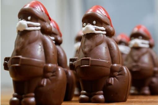 Hungary confectioner makes Santas in masks with Italian chocolate. 
(Credit: Reuters)