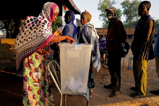 A woman casts her vote at a polling station during the presidential and legislative election in Ouagadougou, Burkina Faso, November 22, 2020. REUTERS/Zohra Bensemra A woman casts her vote at a polling station during the presidential and legislative election in Ouagadougou, Burkina Faso, November 22, 2020. REUTERS/Zohra Bensemra
