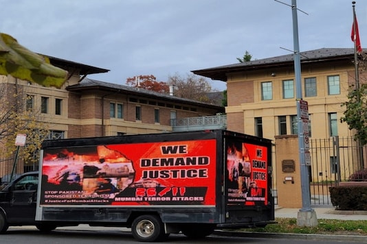 A truck with a billboard, reading A truck with a billboard, reading