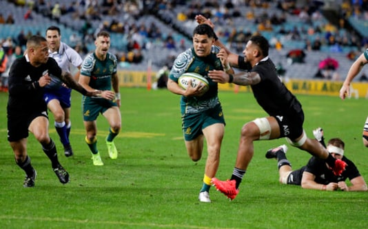 Australia's Noah Lolesio, centre, runs past New Zealand's Richie Mo'unga, right, and Aaron Smith left, to score his team's first try during the Bledisloe rugby test between the All Blacks and the Wallabies at Stadium Australia, Sydney, Australia, Saturday, Oct. 31, 2020. (AP Photo/Rick Rycroft) Australia's Noah Lolesio, centre, runs past New Zealand's Richie Mo'unga, right, and Aaron Smith left, to score his team's first try during the Bledisloe rugby test between the All Blacks and the Wallabies at Stadium Australia, Sydney, Australia, Saturday, Oct. 31, 2020. (AP Photo/Rick Rycroft)