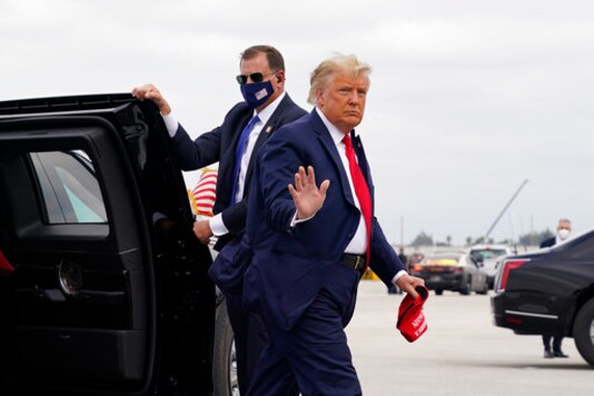 President Donald Trump arrives to board Air Force One for a day of campaign rallies, Monday, Nov. 2, 2020, in Miami. (AP Photo/Evan Vucci) President Donald Trump arrives to board Air Force One for a day of campaign rallies, Monday, Nov. 2, 2020, in Miami. (AP Photo/Evan Vucci)