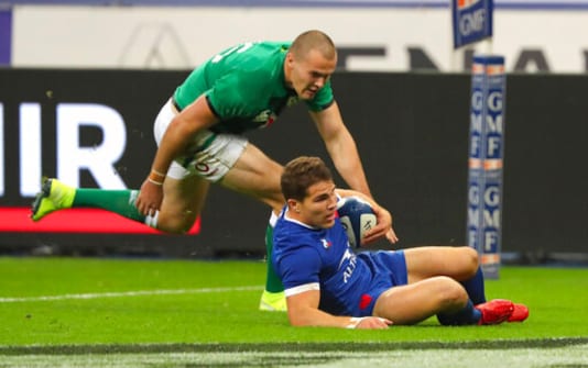 France's Antoine Dupont runs over the line, as Ireland's Jacob Stockdale attempts to stop, to score the first try of the game during the Six Nations rugby union international match between France and Ireland in Paris, France, Saturday, Oct. 31, 2020. (AP Photo/Thibault Camus) France's Antoine Dupont runs over the line, as Ireland's Jacob Stockdale attempts to stop, to score the first try of the game during the Six Nations rugby union international match between France and Ireland in Paris, France, Saturday, Oct. 31, 2020. (AP Photo/Thibault Camus)