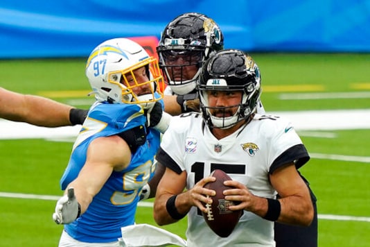 Jacksonville Jaguars quarterback Gardner Minshew, right, is sacked by Los Angeles Chargers defensive end Joey Bosa, left, during the first half of an NFL football game Sunday, Oct. 25, 2020, in Inglewood, Calif. (AP Photo/Alex Gallardo) Jacksonville Jaguars quarterback Gardner Minshew, right, is sacked by Los Angeles Chargers defensive end Joey Bosa, left, during the first half of an NFL football game Sunday, Oct. 25, 2020, in Inglewood, Calif. (AP Photo/Alex Gallardo)