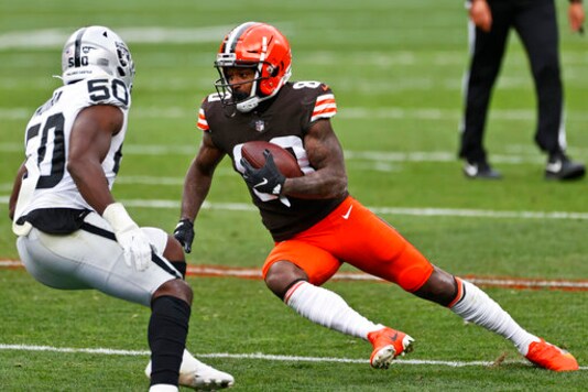 Cleveland Browns wide receiver Jarvis Landry (80) rushes against Las Vegas Raiders linebacker Nicholas Morrow (50) during the first half of an NFL football game, Sunday, Nov. 1, 2020, in Cleveland. (AP Photo/Ron Schwane)