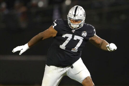 FILE - In this Sept. 9, 2019, file photo, Oakland Raiders offensive tackle Trent Brown (77) protects a gap in the offensive line during an NFL football game against the Denver Broncos, in Oakland, Calif. The Las Vegas Raiders sent all five starting offensive linemen home as part of coronavirus contact tracing after right tackle Trent Brown was placed on the reserve/COVID-19 list with a positive test. The Raiders held practice on Wednesday, Oct. 21, 2020 without their starting five as they prepare for Sundays home game against Tampa Bay. (AP Photo/Peter Joneleit, File)