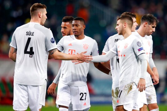 Bayern's Niklas Suele, from left, David Alaba and Lucas Hernandez celebrate after the Champions League group A soccer match between Lokomotiv Moscow and Bayern Munich in Moscow, Russia, Tuesday, Oct. 27, 2020. (Maxim Shemetov/Pool via AP)