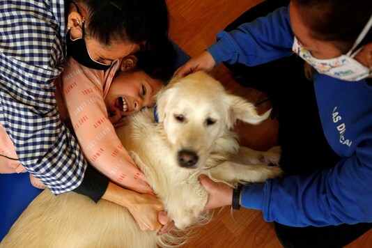 Student Inas, who is blind, embraces Student Inas, who is blind, embraces