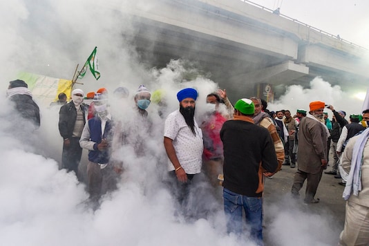 A civic worker carries out fumigation as farmer protest against new farm laws, at Ghazipur border, in New Delhi, Tuesday, Dec 01 2020.  (Image: PTI)