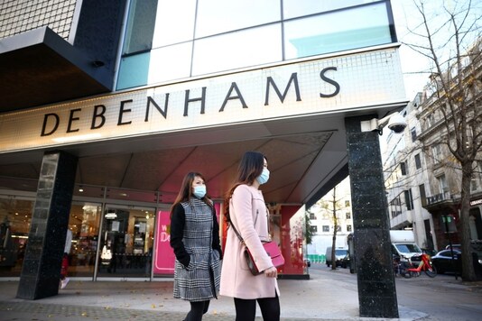People walk past a Debenhams store on Oxford street in London, Britain, December 1, 2020. REUTERS/Henry Nicholls
