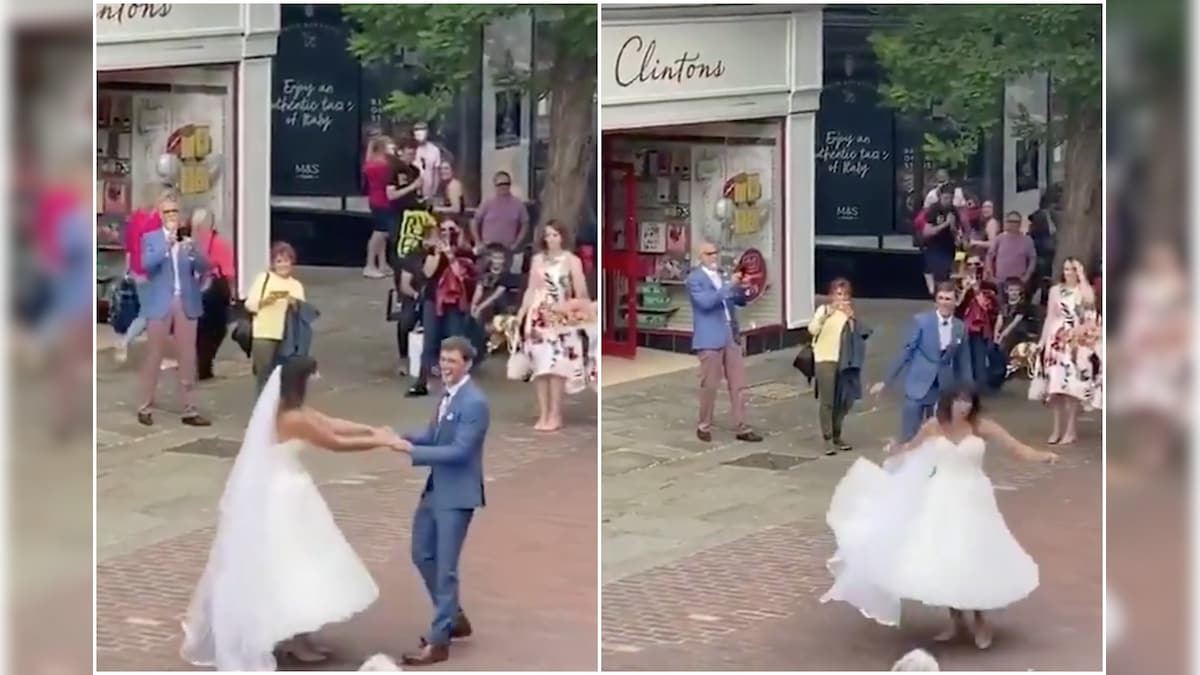 Watch: Newlyweds Dance in Busy Market Square as Busker Serenades Couple in UK Street