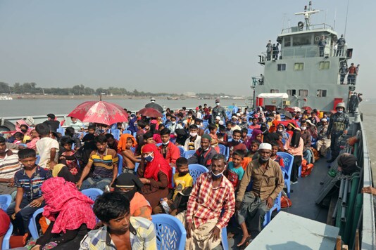 Rohingya refugees are transported on a naval vessel to Bhashan Char, or floating island, in the Bay of Bengal, from Chittagong, Bangladesh, on December 4, 2020. (AP Photo)