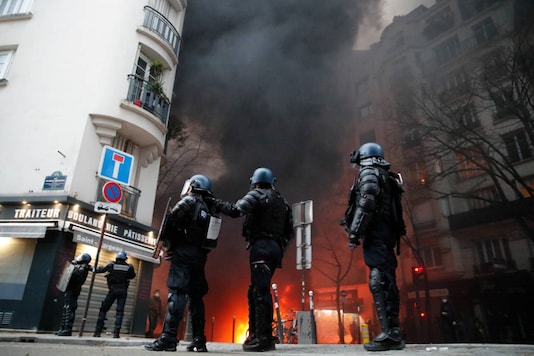 Riot police officers take position during a demonstration on December 5, 2020 in Paris. (AP Photo/Francois Mori) Riot police officers take position during a demonstration on December 5, 2020 in Paris. (AP Photo/Francois Mori)