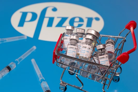 A small shopping basket filled with vials labeled 