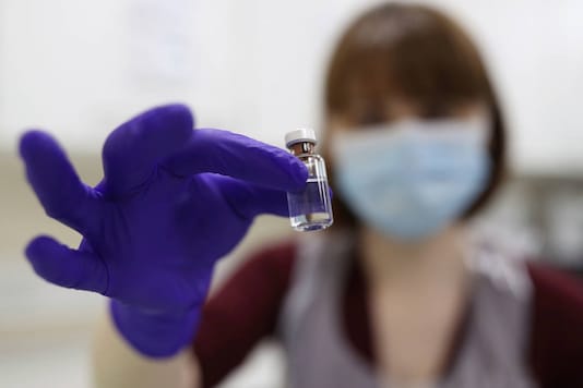 A NHS pharmacy technician at the Royal Free Hospital simulates the preparation of the Pfizer vaccine to support staff training ahead of the rollout, in London on December 4, 2020. (Yui Mok/Pool Photo via AP) A NHS pharmacy technician at the Royal Free Hospital simulates the preparation of the Pfizer vaccine to support staff training ahead of the rollout, in London on December 4, 2020. (Yui Mok/Pool Photo via AP)