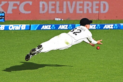 New Zealand’s Will Young dives in a fielding attempt against the West Indies during play on day three of their first cricket test in Hamilton, New Zealand, Saturday, Dec. 5, 2020. (Andrew Cornaga/Photosport via AP)