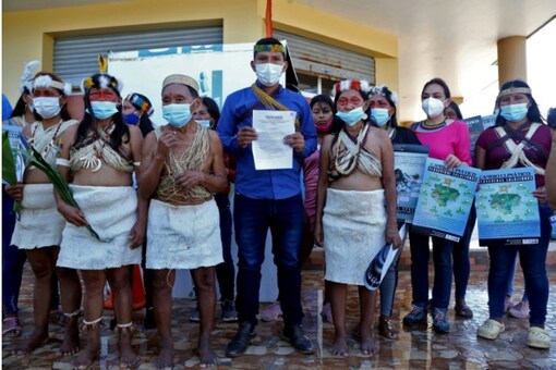 Waorani indigenous women pictured after filing a climate change lawsuit against Chinese oil company PetroOriental in El Coca, Orellana province, Ecuador, on December 10, 2020 / AFP.