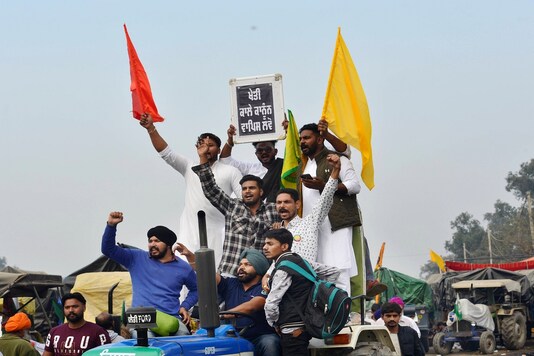 Farmers shout slogans at Singhu border during their 'Delhi Chalo' protest march against the Centre's new farm laws. (PTI photo)