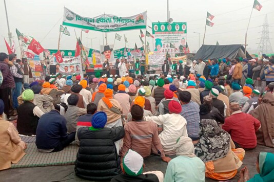 File photo: Bharatiya Kisan Union spokesperson Rakesh Tikait addresses farmers during their protest against the new farm laws, at Ghazipur border in New Delhi, on December 12, 2020. (PTI Photo)