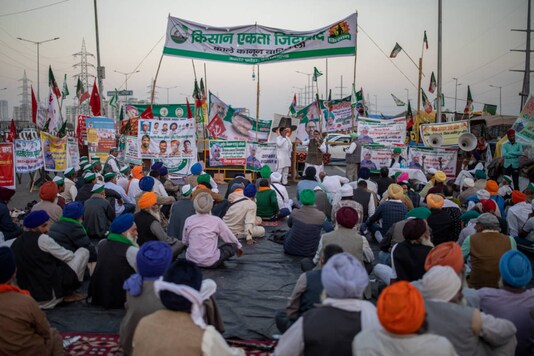 For representation: Farmers listen to a speaker, sitting in the middle of an expressway at the site of a protest against new farm laws at the Delhi-Uttar Pradesh border. (AP Photo/Altaf Qadri)