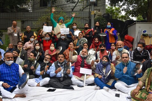 Mayor of North Delhi Jai Prakash and other senior functionaries during a protest outside Delhi Chief Minister Arvind Kejriwal's residence, in New Delhi, Saturday, Dec. 12, 2020. (PTI Photo)