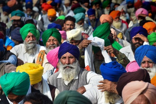 Farmers at Singhu border during their sit-in protest against the Centre's farm reform laws, in New Delhi.