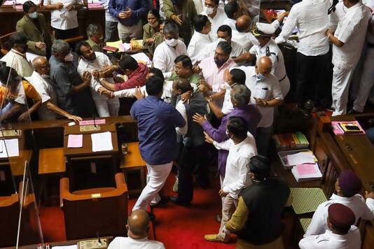 Ruckus between BJP and Congress leaders over the chairman post during the Karnataka Legislative Council in Bengaluru, Tuesday, Dec. 15, 2020. (PTI Photo)