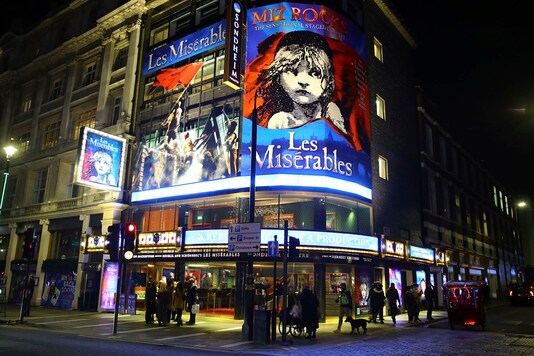 People leave the Sondheim Theatre, in London, where 
