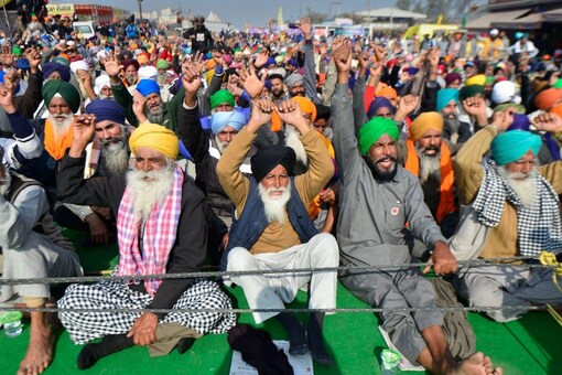 New Delhi: Farmers shout slogans during their protest against the new farm laws, at Singhu Border in New Delhi, Wednesday, Dec. 16, 2020. (PTI Photo/Ravi Choudhary)(