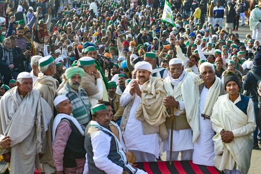Bharatiya Kisan Union (BKU) national president Naresh Tikait along with other 'Khap' leaders during farmers' protest against the Center's new farm law at Ghazipur border, in Ghaziabad on December 17, 2020. (PTI Photo/Vijay Verma)