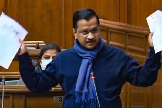 Delhi Chief Minister Arvind Kejriwal tears copies of new farm laws as he speaks at Delhi Legislative Assembly, on December 17, 2020. (PTI Photo)