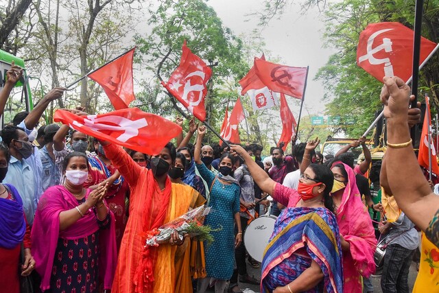 Left Democratic Front (LDF) supporters celebrate their party's win in the Kerala local body elections in Kochi, on Wednesday, Dec. 16, 2020. (PTI Photo)
