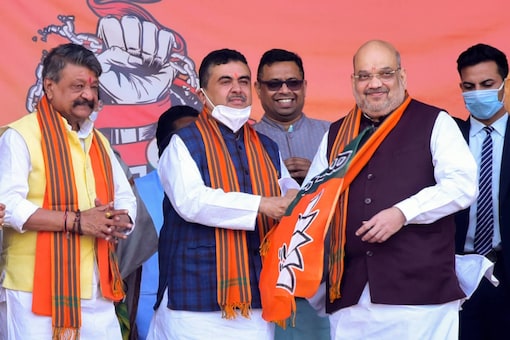 File photo: Union home minister Amit Shah with Suvendu Adhikari at a rally in West Midnapore district on December 19, 2020. (PTI Photo)