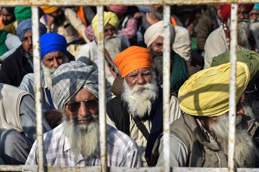 File photo of farmers during their protest against the farm laws at Singhu Border, in New Delhi. (Image: PTI)