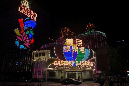 FILE PHOTO: A night view of the Casino Lisboa after gambling recommenced at midnight, in Macau, China February 20, 2020. REUTERS/Aleksander Solum/File Photo