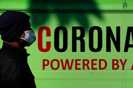 A man walks past a mobile Covid-19 testing clinic. (Representative image/AP)